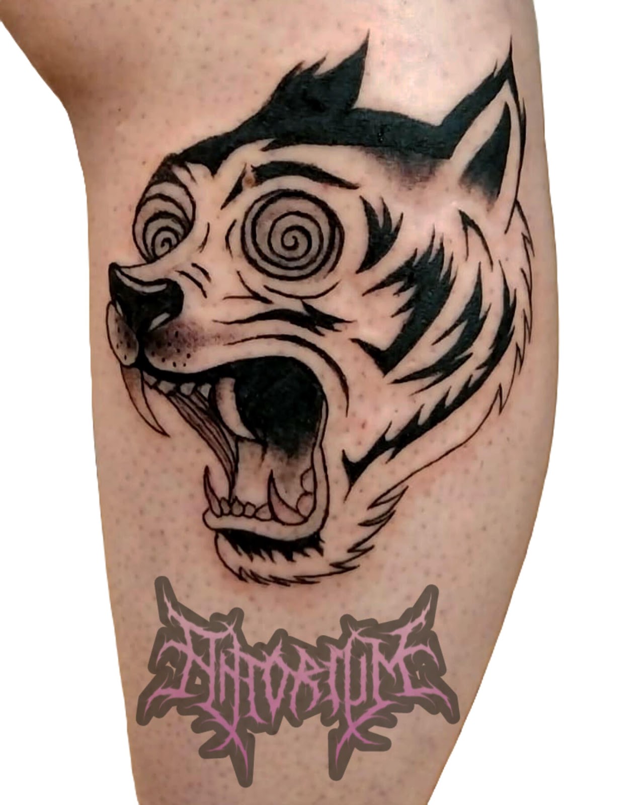 Tattoo artist working